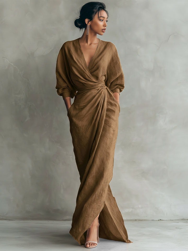 Draped V-neck wrap maxi dress with elegant batwing sleeves. A stunning choice for formal evening events.