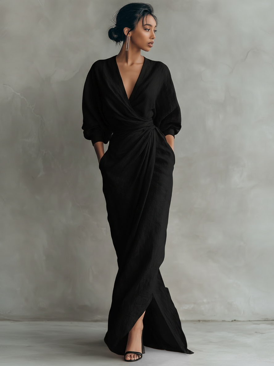 Women's sophisticated V-neck maxi dress with draped batwing sleeves, suitable for formal occasions.