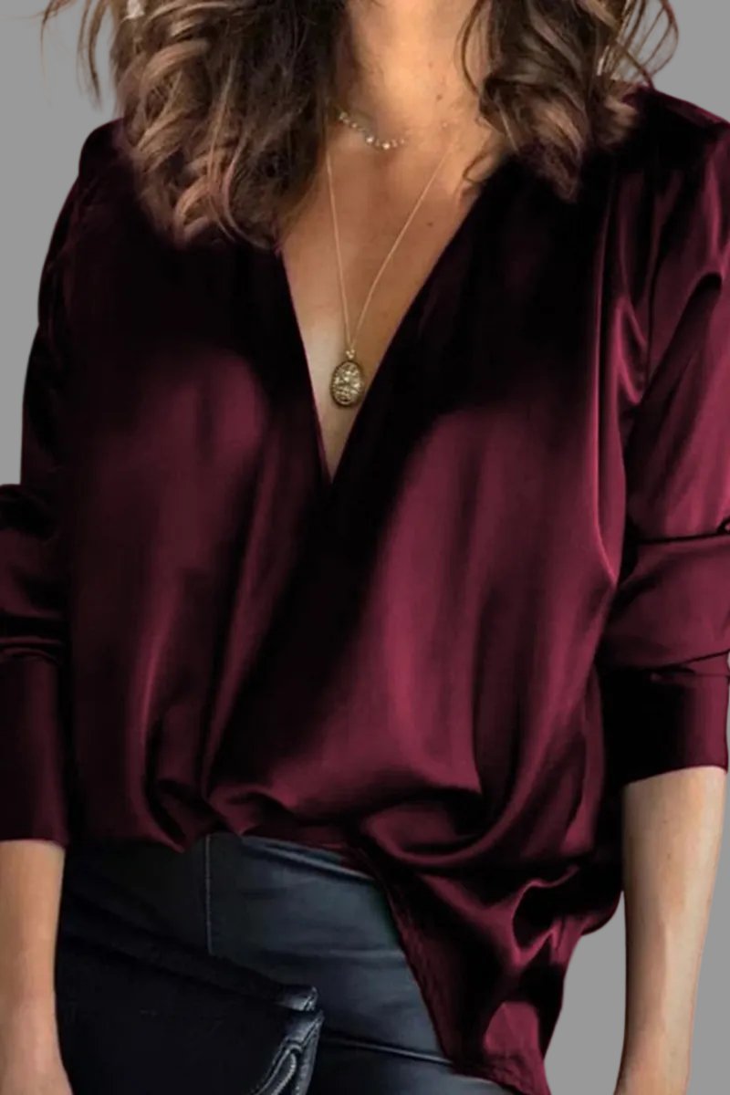 Chic women's draped V-neck blouse, relaxed fit. Versatile elegant top for evening or sophisticated day wear.