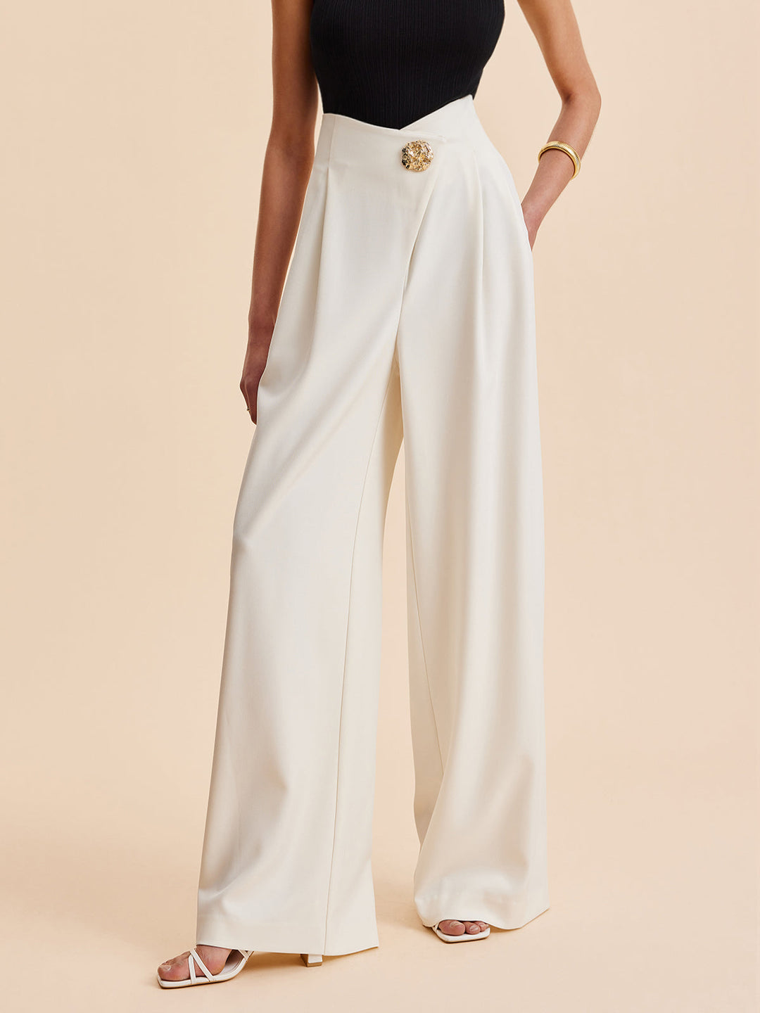 Elegant women's embellished high-waist wide-leg pants. Perfect long trousers for workwear or casual chic.
