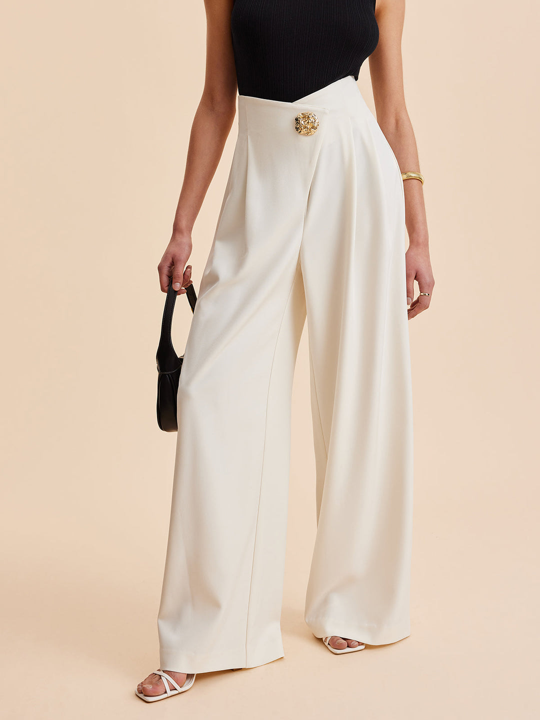 Khaki wide-leg high-waist pants with unique embellishments for women. Ideal for elegant workwear fashion.
