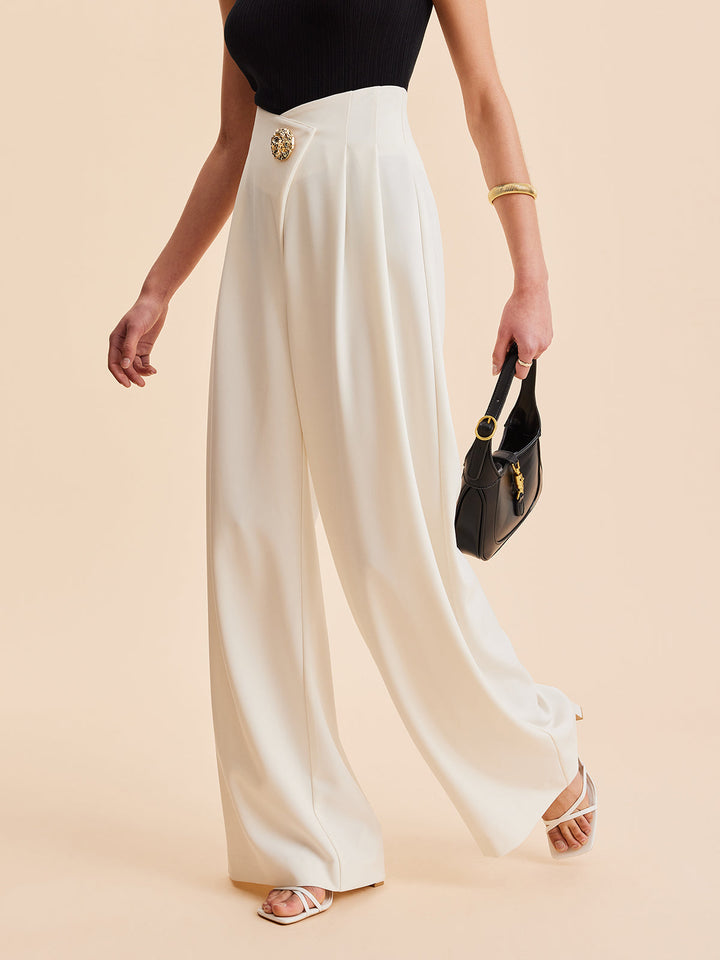 Black embellished high-waist wide-leg women's pants. Asymmetrical design for a sophisticated & modern look.