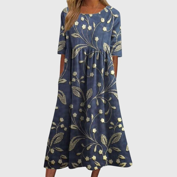Elegant women's embroidered flowy midi dress, perfect for summer casual wear or special occasions.