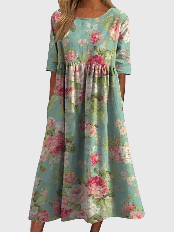 Versatile women's midi dress with intricate embroidery, flowy design for a comfortable, chic look.