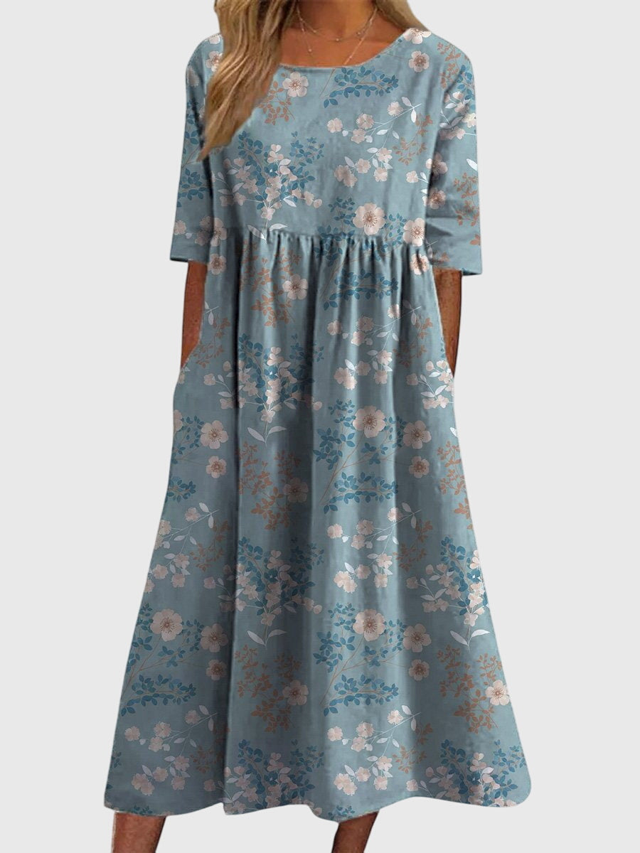 Women's summer midi dress, featuring flowy fabric and intricate embroidery, perfect for casual or dressed-up events.