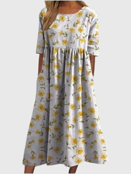 Graceful women's flowy midi dress with detailed embroidery, suitable for versatile styling and special events.