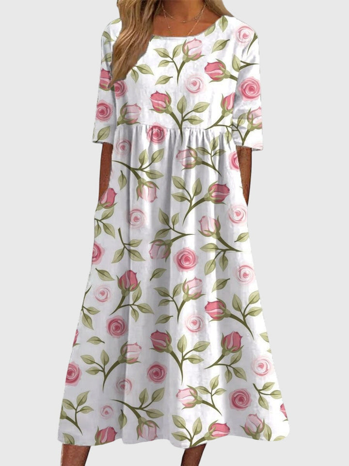 Relaxed fit embroidered midi dress for women, offering an elegant yet comfortable style for any fashion occasion.
