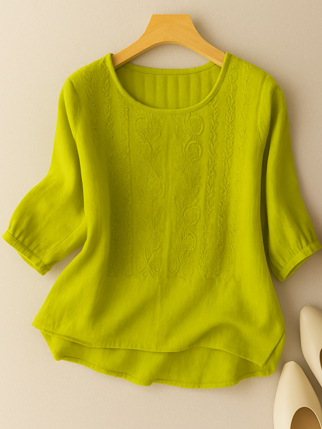 Women's relaxed fit blouse with delicate embroidery. Chic long sleeve top for modern, feminine everyday style.