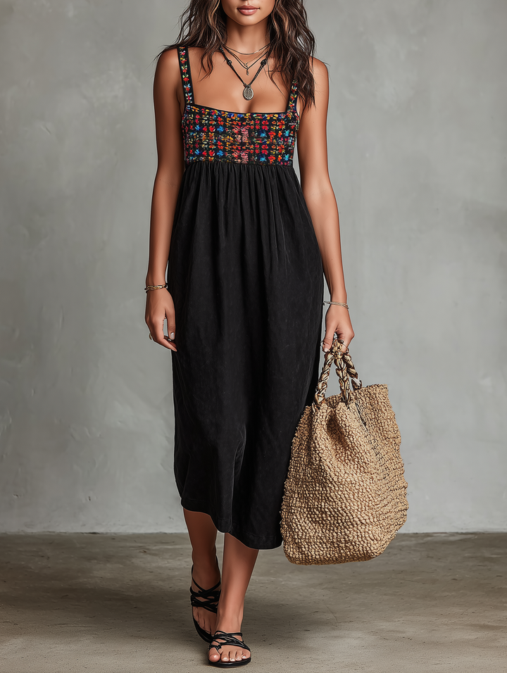 Elegant women's embroidered sleeveless midi dress with round neck, perfect for daytime or vacation wear.