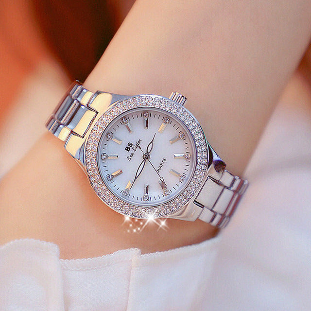 Elegant Women's Esmée 32mm Quartz Watch with classic round dial, a sophisticated ladies fashion accessory.