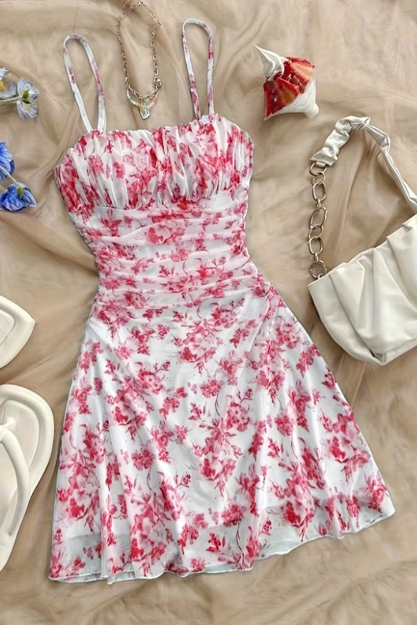 Women's vibrant floral mini dress. Flared skirt, elegant halter neck, perfect for summer parties & vacations.