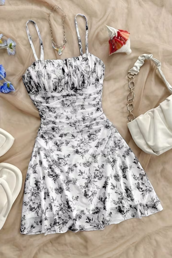 Stylish women's fit-and-flare floral mini dress. Elegant summer party dress, ideal for vacation outfits.