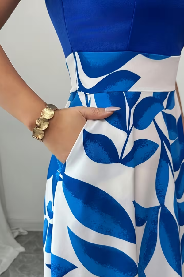 Comfortable women's floral A-line maxi dress with V-neck and pockets, a chic and versatile summer essential.