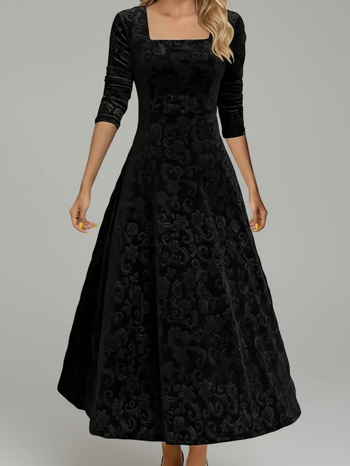 Close-up of elegant floral print on women's A-line midi dress with long sleeves & square neckline, fall fashion.