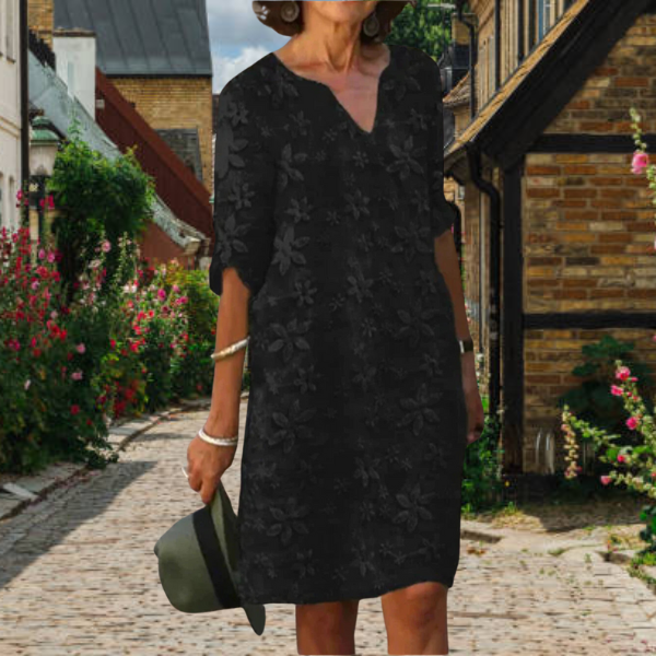 Close-up of vibrant floral appliqué detail on a stylish Women's Notch Neck Midi Summer Dress with 3/4 sleeves.