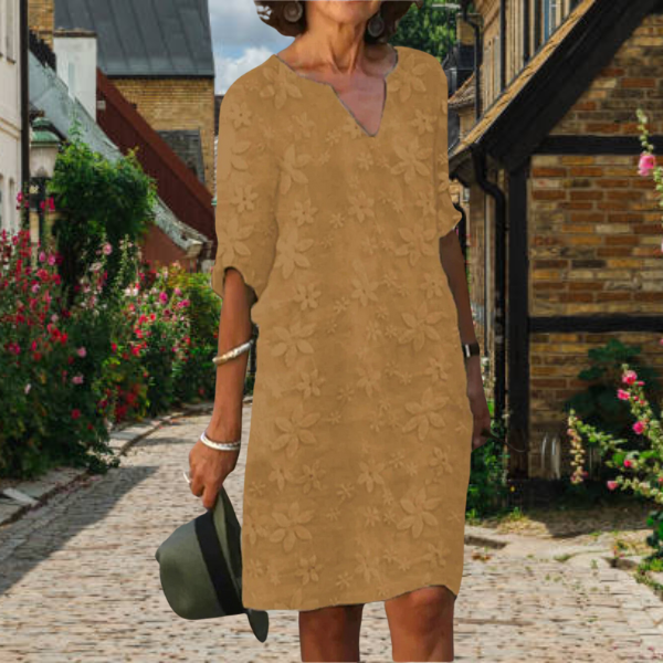 Stylish Women's Summer Midi Dress featuring floral appliqué, a notch neck, and comfortable 3/4 sleeves. Relaxed fit.