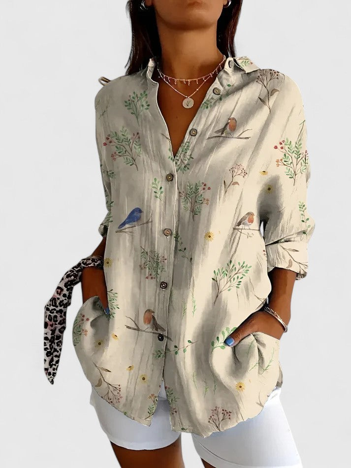 Chic women's floral top, ideal for office wear or casual outings. Versatile elegant blouse for ladies.