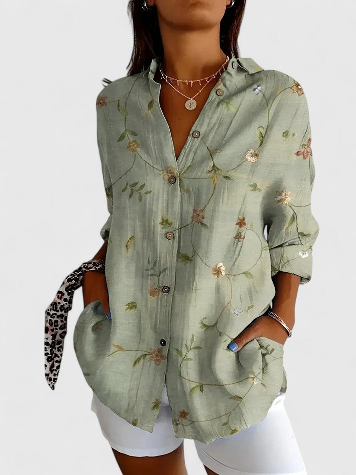 Versatile women's floral blouse. Elegant top for spring & summer, suitable for casual or professional looks.