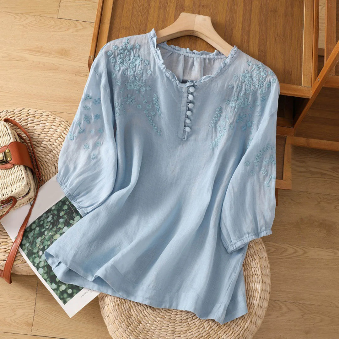 Elegant women's floral button-front blouse with long sleeves, perfect for casual chic or spring style.