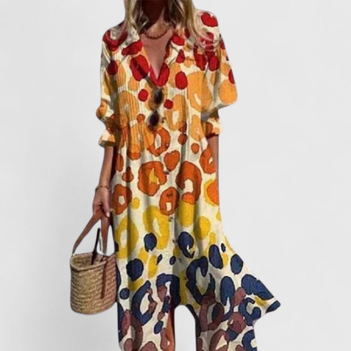 Chic bohemian floral maxi dress with button front, ideal for beach, vacation, or elegant resort wear.