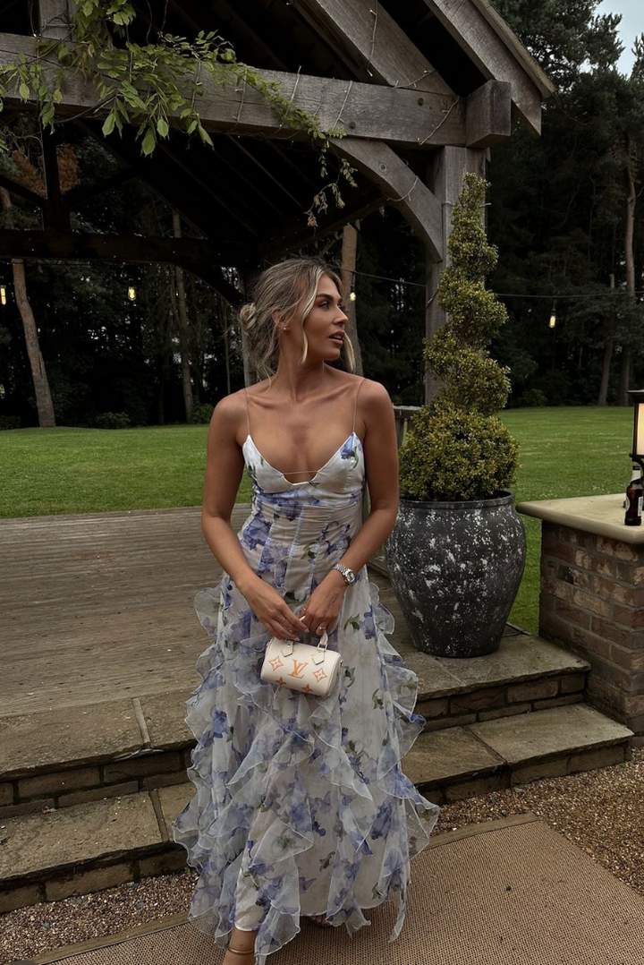 Adjustable strap floral corset maxi dress with elegant ruffles, a sophisticated choice for any wedding guest.