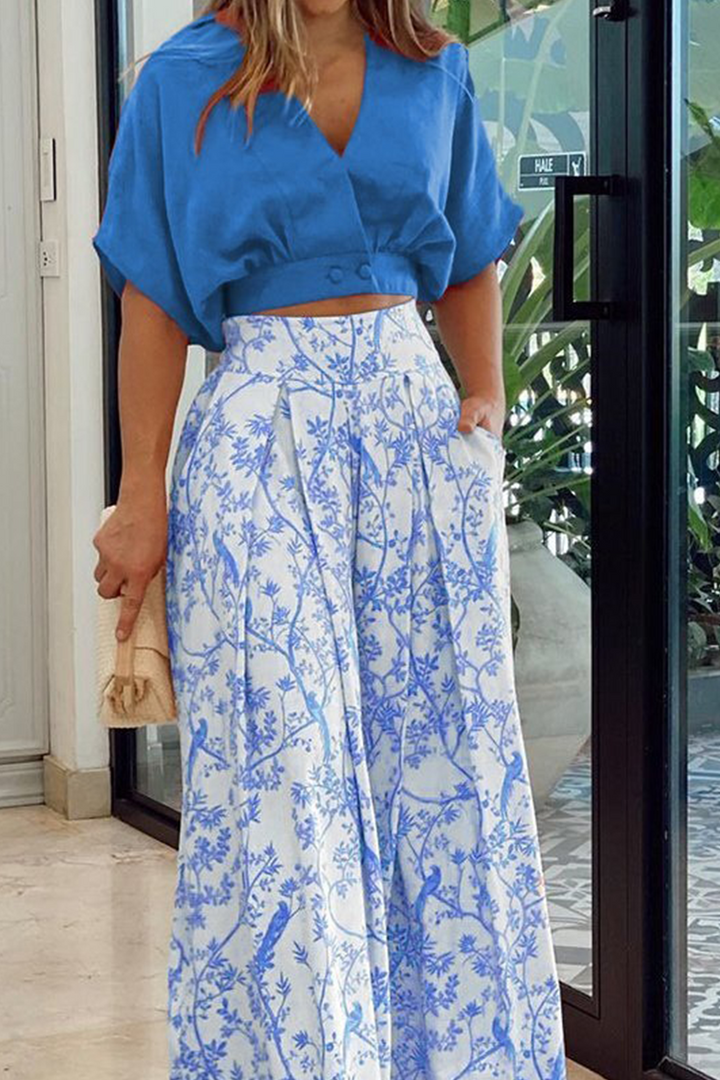 Stylish women's matching set: floral crop top & flowy maxi skirt. Perfect vacation fashion with an elegant print.
