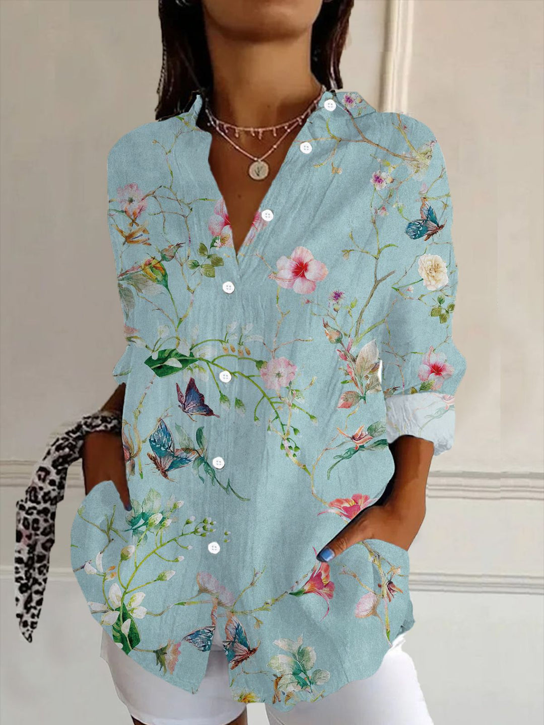 Stylish women's flowy V-neck blouse with elegant floral embossed design. Ideal for spring fashion & summer style.