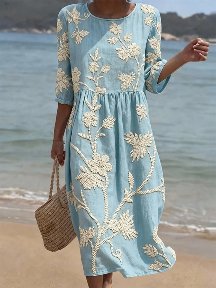 Elegant women's floral embroidered midi dress with comfortable 3/4 sleeves and round neck for spring/summer.