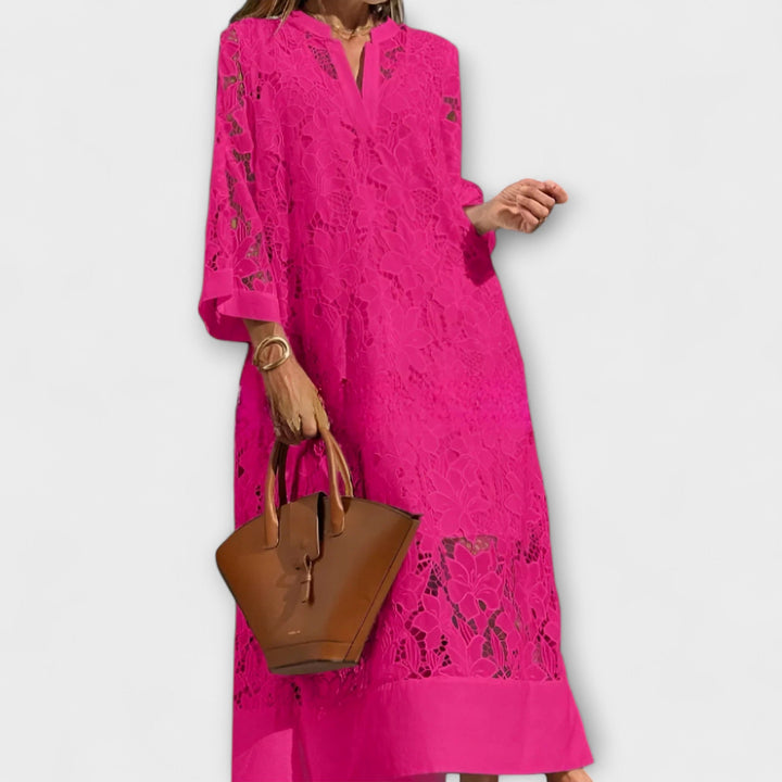 Stylish women's summer midi dress with delicate floral embroidery and short sleeves for a casual elegant look.