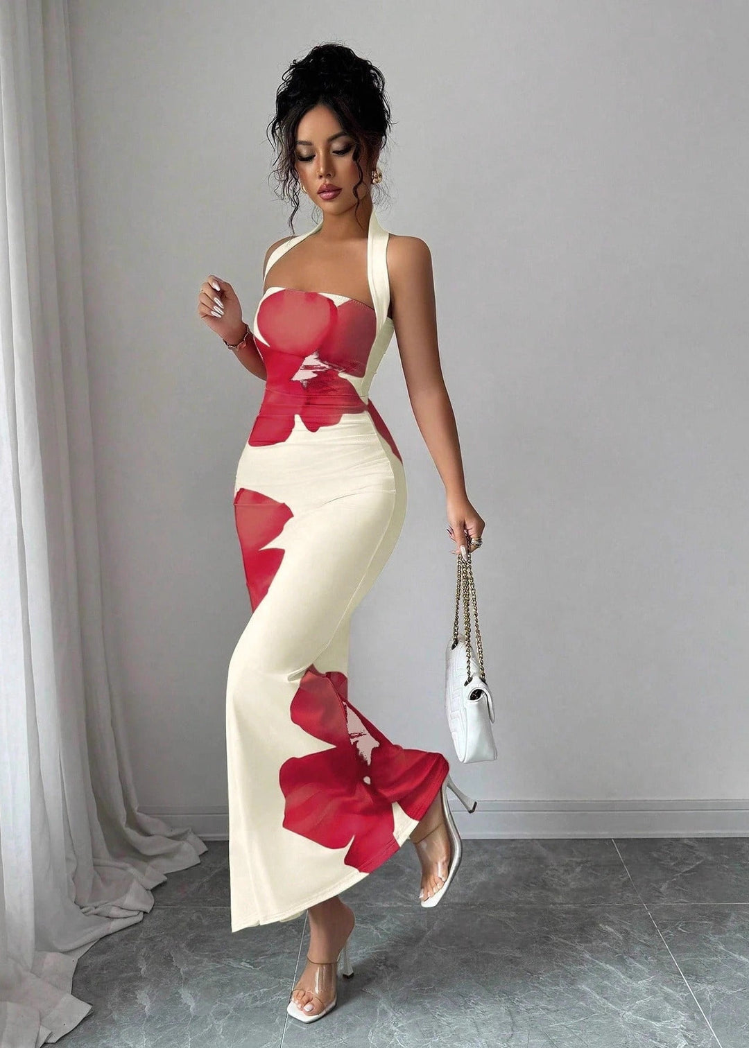 Elegant women's floral halter maxi dress, perfect for summer parties or special occasions, showcasing a beautiful floral pattern.