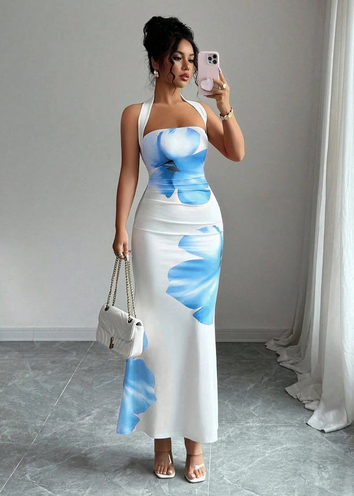Vibrant floral print halter maxi dress for women, ideal for resort wear & summer events, featuring an elegant flowy design.
