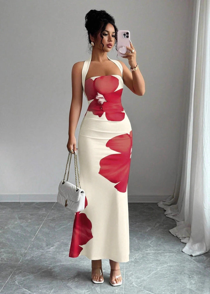 Stunning women's halter neck maxi dress with elegant floral print, suitable for formal summer events & evening parties.