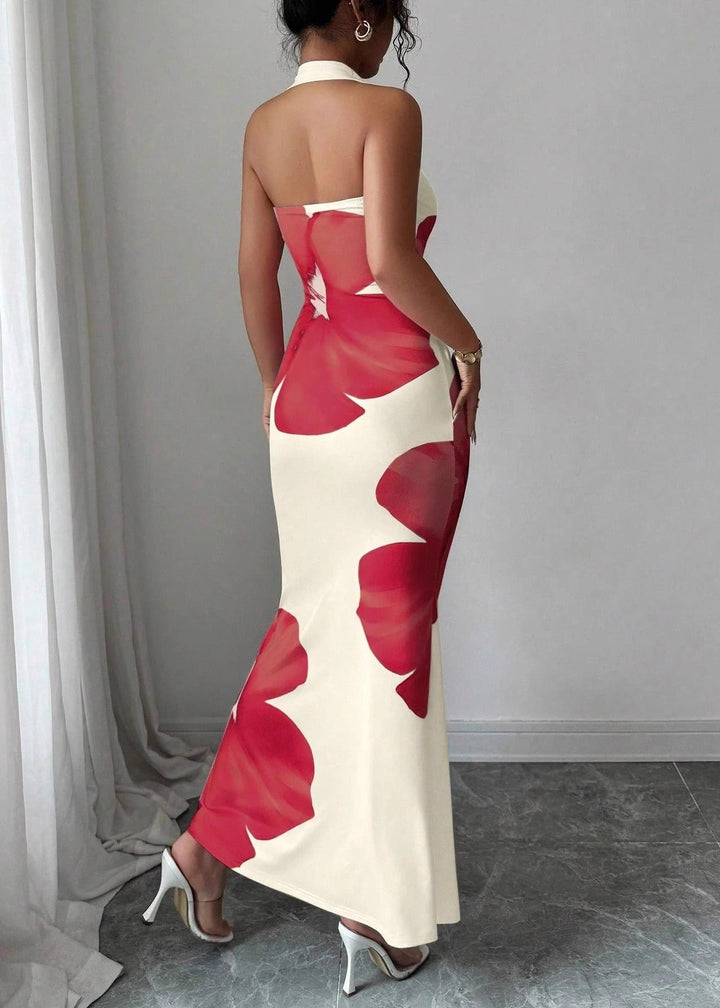 Chic women's halter neck maxi dress, adorned with a graceful floral pattern, perfect for summer elegance & resort fashion.