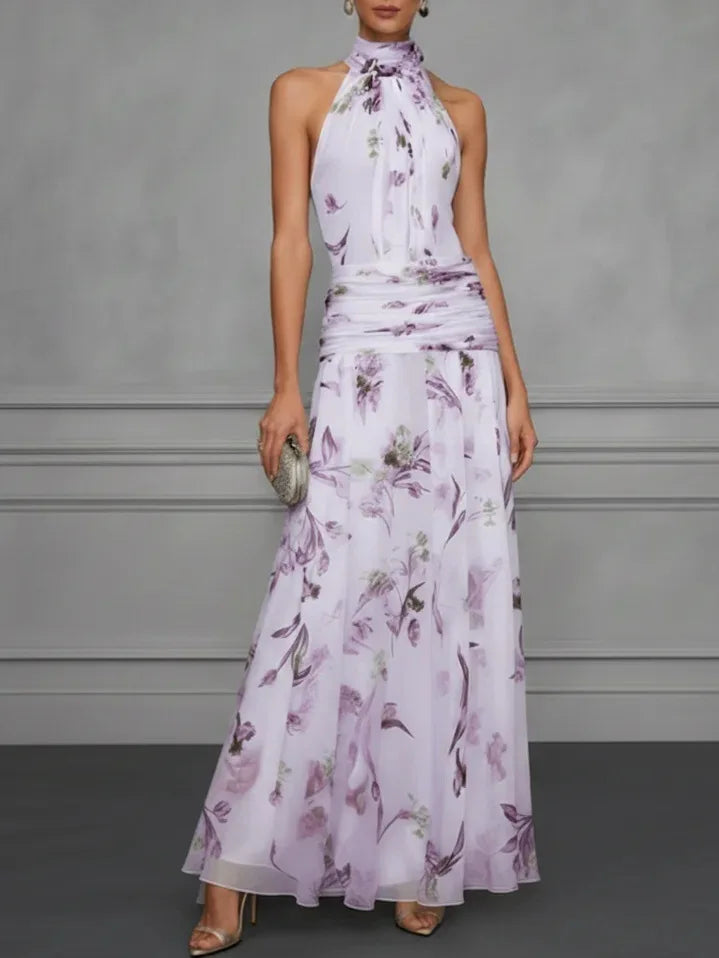 Vibrant floral print halter maxi dress, an elegant summer outfit for women, ideal for outdoor events & parties.