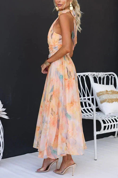 Chic women's graceful floral halter maxi dress, a sophisticated option for any elegant evening or resort event.