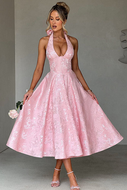 Charming floral midi dress for events, featuring a flattering corset and stylish halter neck.