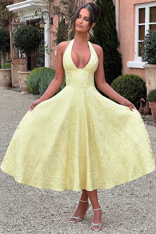 Romantic floral wedding guest outfit: A-line midi dress with halter neck & structured corset.