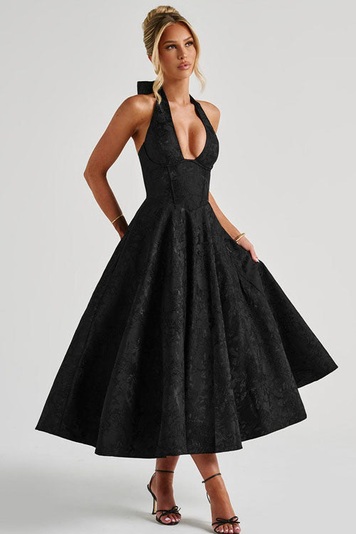 Fashionable floral midi dress with a corset bodice and halter neckline, perfect for spring weddings.