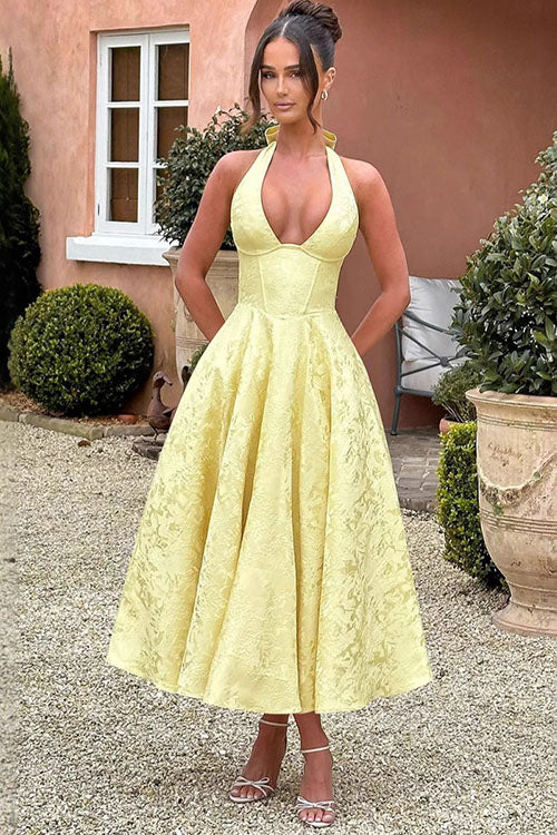 Elegant women's midi dress, floral print, halter neck, corset style, suitable for evening wear.