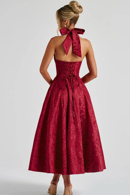 Romantic floral print midi dress, a wedding guest essential, with a halter neck & corset.