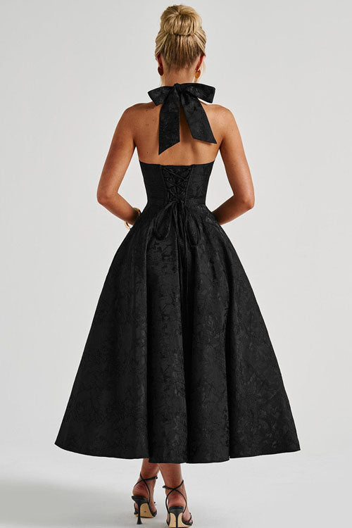Stylish A-line floral midi dress, a stunning choice for wedding guests, with halter and corset.