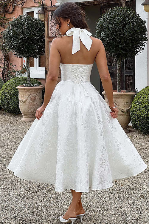 Elegant floral midi dress with an A-line silhouette, halter neck, and intricate corset design.