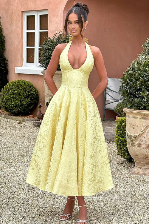 Beautiful floral wedding guest dress, midi length, halter neck, and elegant corset styling.