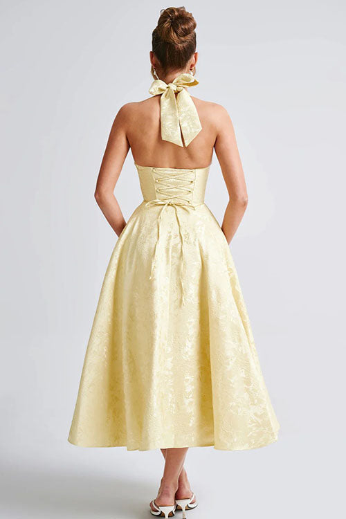 Stylish floral midi dress with a structured corset and graceful halter neck, perfect for events.