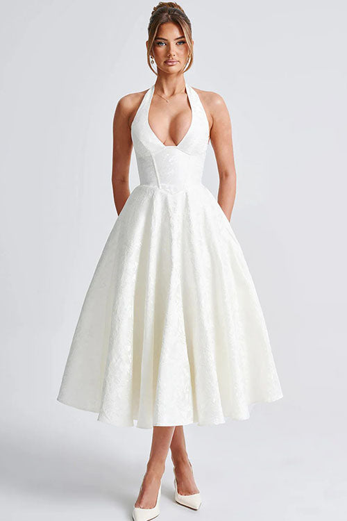 Chic floral midi dress with a flattering corset and sophisticated halter neck, perfect for parties.
