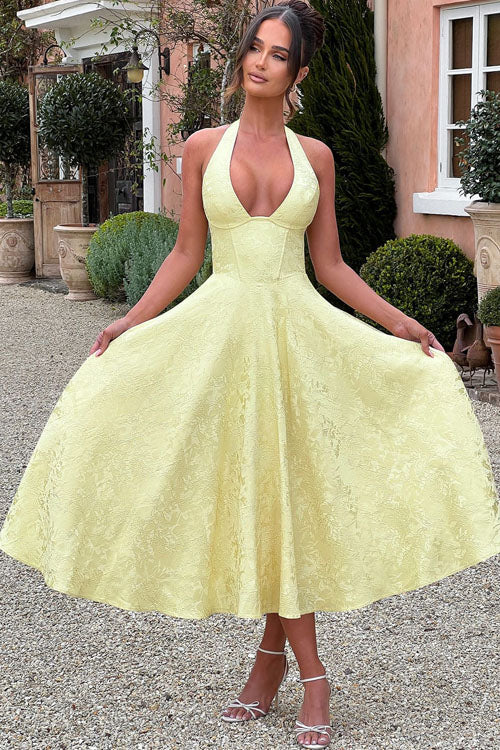 Elegant floral A-line midi dress, perfect for wedding guests, with a charming halter and corset.