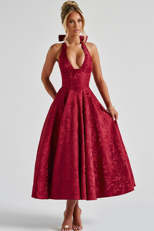 Feminine wedding guest dress, floral pattern, midi length, with a charming halter corset design.
