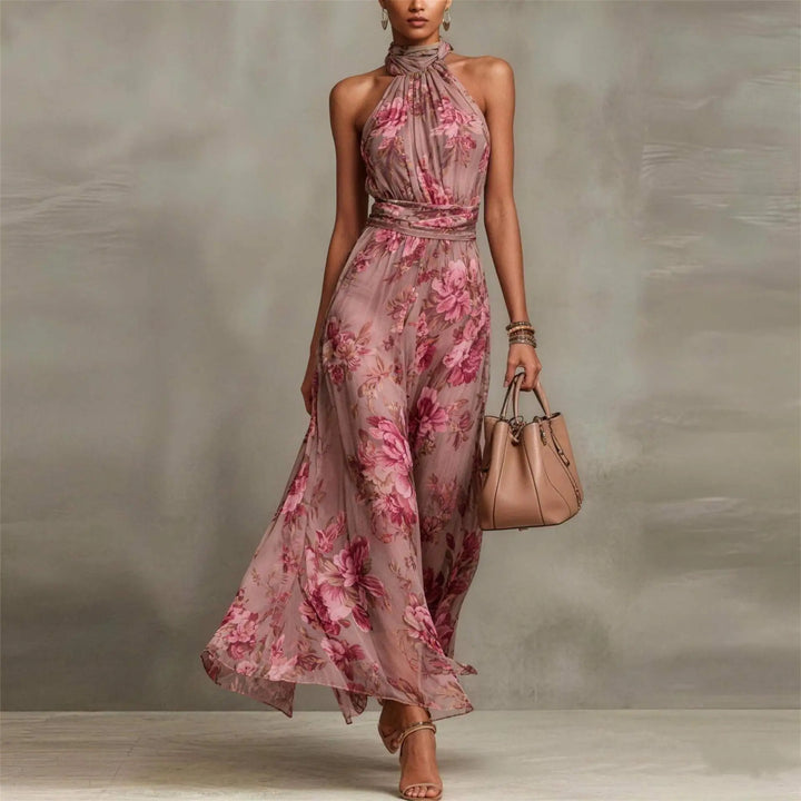 Stylish women's sleeveless floral maxi dress with halter neck. Perfect flowy summer dress for elegant resort wear.