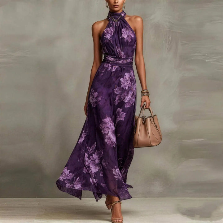 Women's floral halter neck maxi dress. Elegant summer flowy sleeveless dress for vacation, resort, or party wear.