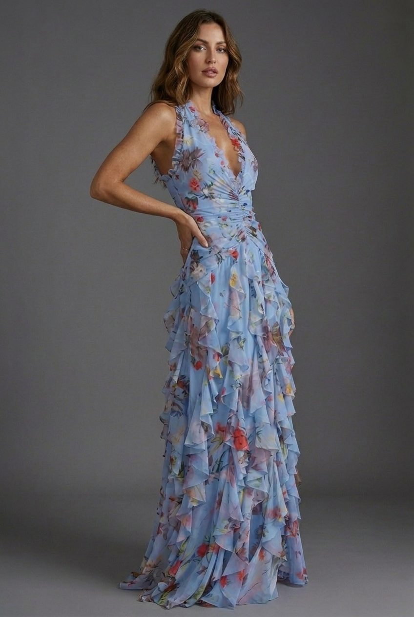 Stunning women's floral halterneck maxi dress with elegant ruffle skirt, a beautiful wedding guest outfit.